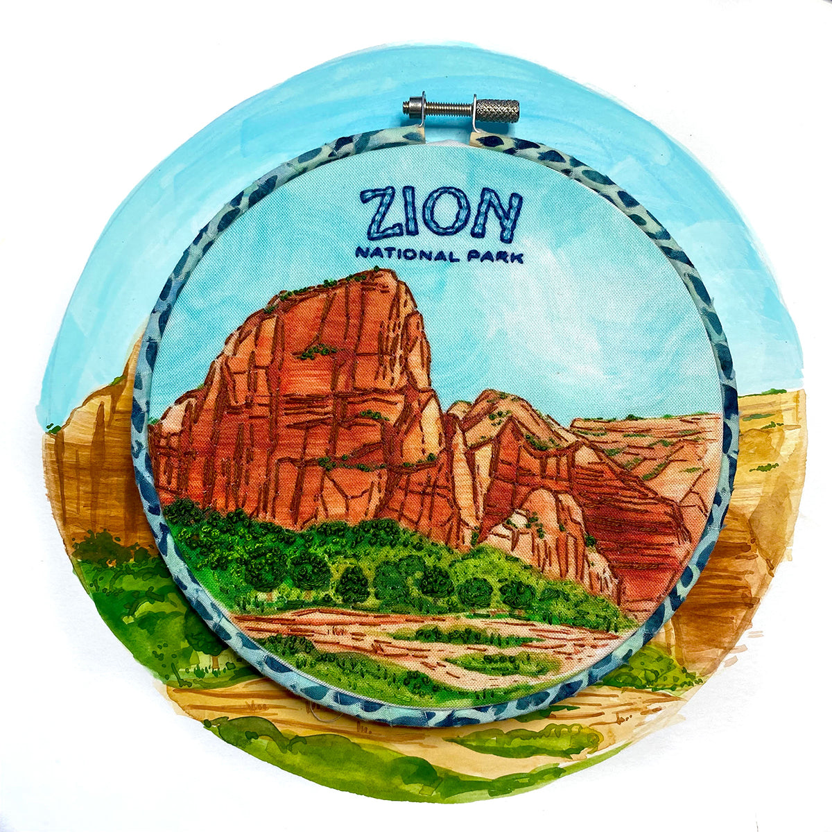 Zion National Park Embroidery Kit in a hoop sitting on top of an illustration of Zion Angels Rest